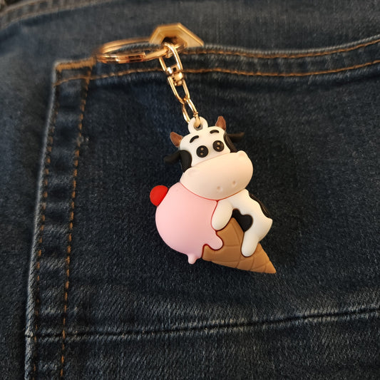 Wisconsin Dairy Pride 2026 limited edition cow keychain attached to keys on denim background