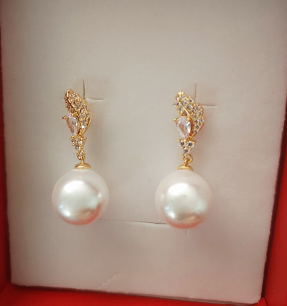 Aurea Vigilat — White Pearl Drop Earrings-Feather-Posts