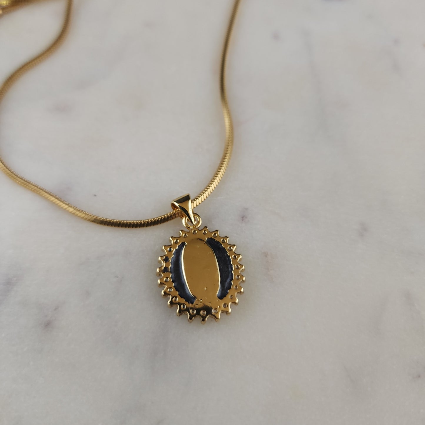 Virgen de Guadalupe Medallion Necklace

18K Gold Plated · Cubic Zirconia · Square Snake Chain