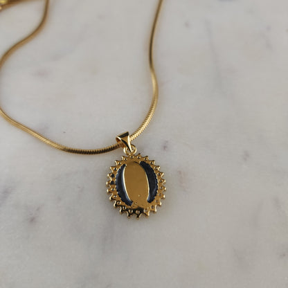 Virgen de Guadalupe Medallion Necklace

18K Gold Plated · Cubic Zirconia · Square Snake Chain