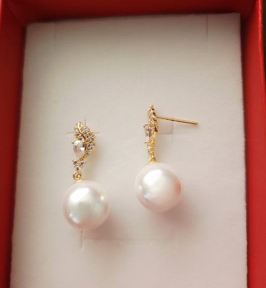 Aurea Vigilat — White Pearl Drop Earrings-Feather-Posts